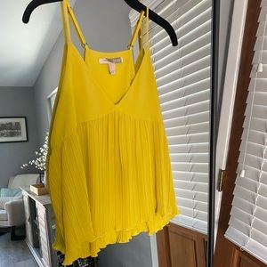 Forever 21, yellow pleated tank top, size women’s medium.